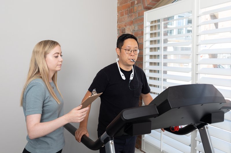 Man on treadmill using PoNS device